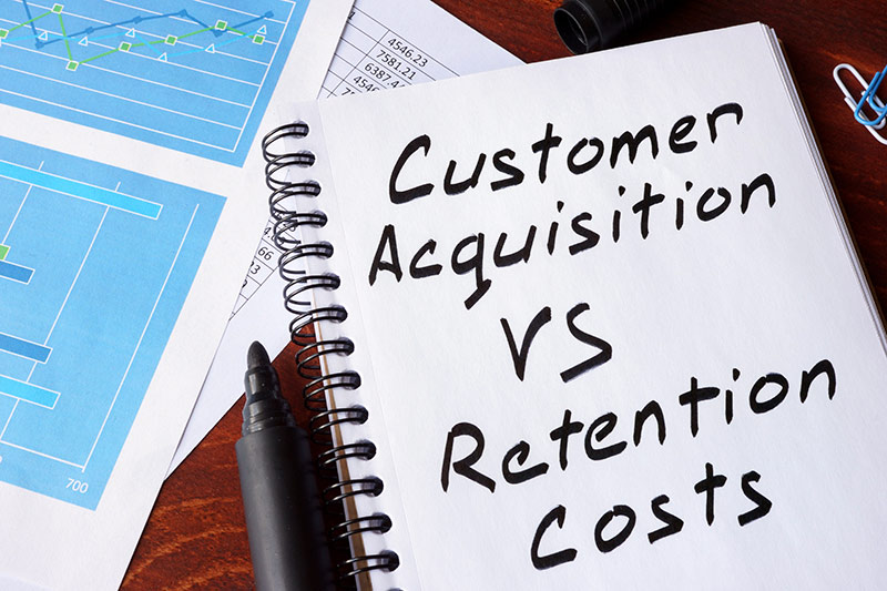 customer acquisition vs retention costs written in a note